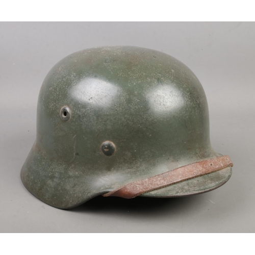 143 - A German World War Two M40 steel helmet.