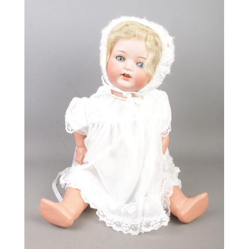 148 - An Armand Marseille bisque head porcelain doll stamped 1330. A.7.M to neck along with a similar unma... 