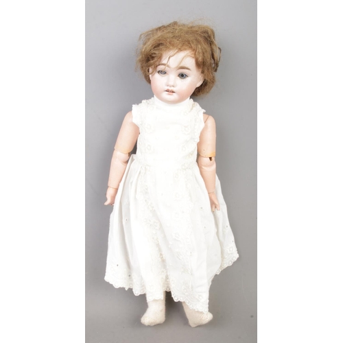 153 - An Armand Marseille bisque head porcelain doll stamped 1894 A.M ½ DEP to base of neck.