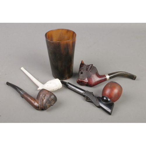 167 - A horn beaker with contents of four smoking pipes. Includes RAOB examples, novelty rifle example and... 