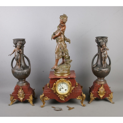 169 - A three-piece Auguste Moreau spelter and marble clock garniture featuring central maiden figure alon... 