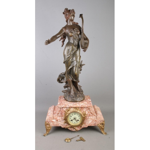 173 - A large spelter and marble clock featuring figure of a maiden playing a dolphin Lyre. Approx. height... 