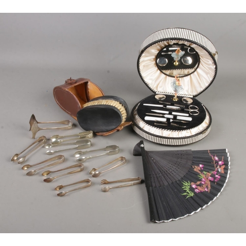 174 - A quantity of collectables. Includes musical cased manicure set, hand fan, brush set and ten pairs o... 