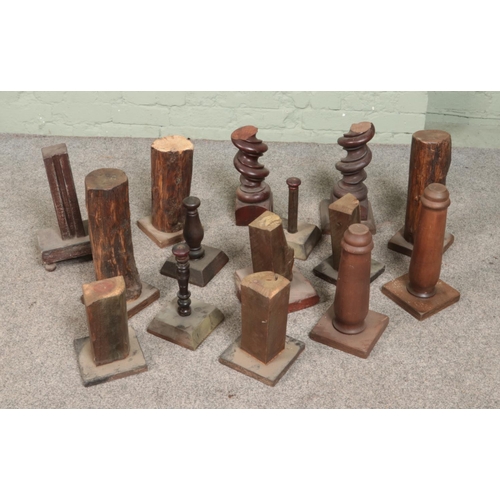 191 - A collection of wooden stands. Includes turned, naturalistic and twist examples.