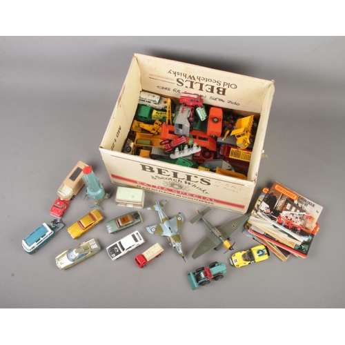 221 - A box of loose diecast vehicles to include Dinky Battle of Britain Junkers, Lesney, Matchbox, Corgi,... 