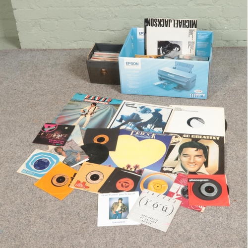 232 - One box and one carry case of vinyl records and singles to of mainly pop and easy listening to inclu... 