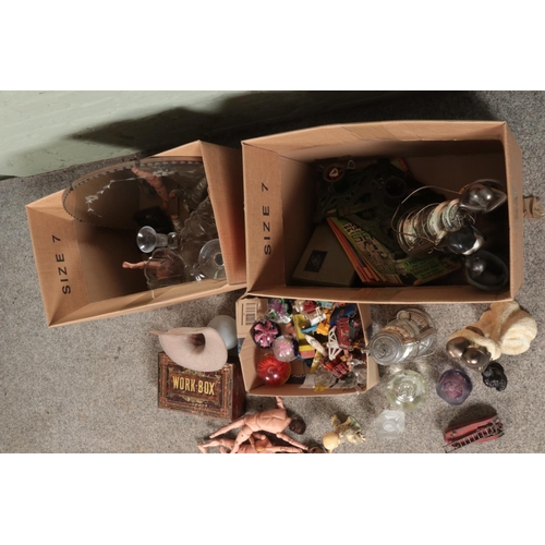 234 - Two boxes of miscellaneous to include glass paperweights, diecast vehicles, composite figures, circu... 