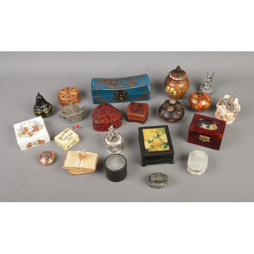 253 - A collection of assorted novelty trinket boxes to include papier mache, hardstone and ceramic exampl... 