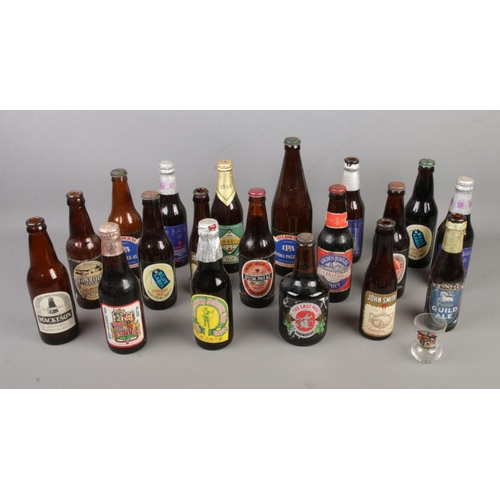 261 - A collection of beer and advertising bottles including Blue Label, Silver Jubilee and Guild Ale, Ind... 