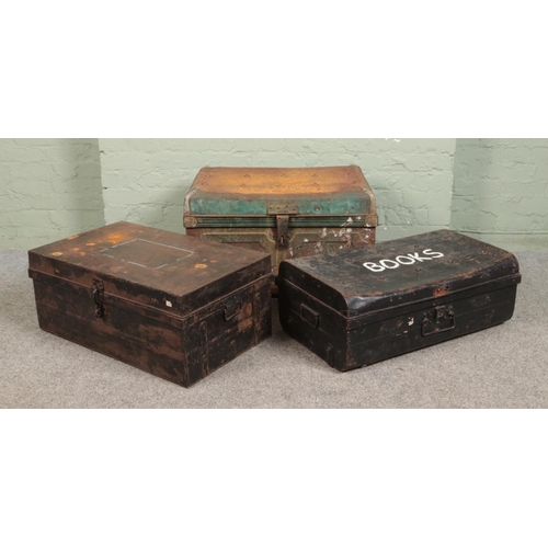 275 - Three hinged top tin trunks; Largest - Height: 44cm, Width: 74cm, Depth: 39cm.