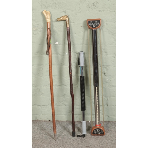 285 - Two walking sticks including bone handled example along with two vintage chest expanders.