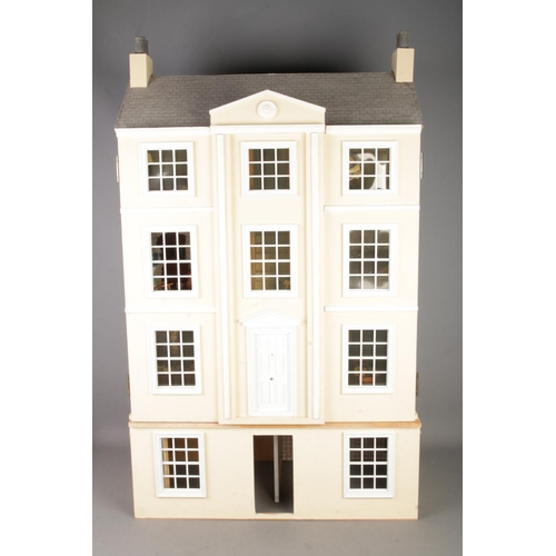 305 - A large three storey fitted doll house complete with electronic wiring and good selection of furnitu... 