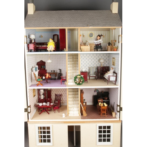 305 - A large three storey fitted doll house complete with electronic wiring and good selection of furnitu... 