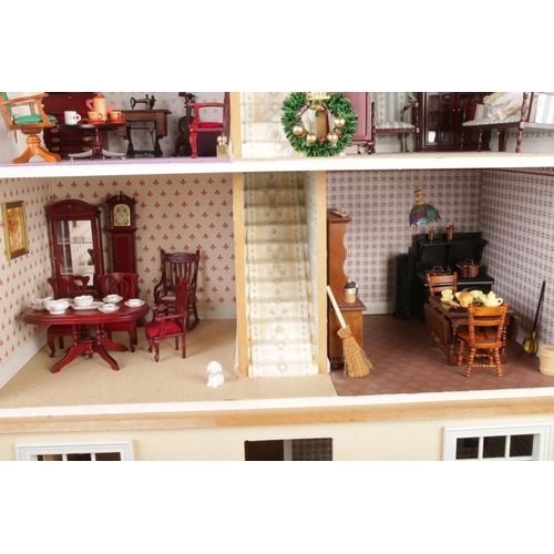 305 - A large three storey fitted doll house complete with electronic wiring and good selection of furnitu... 