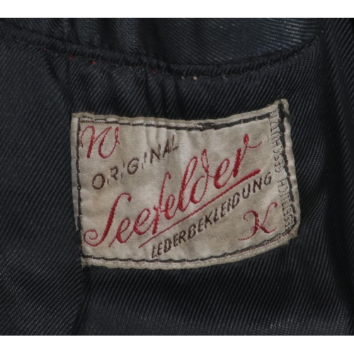 311 - A full length black leather jacket. Bearing label for Seefelder, Germany.