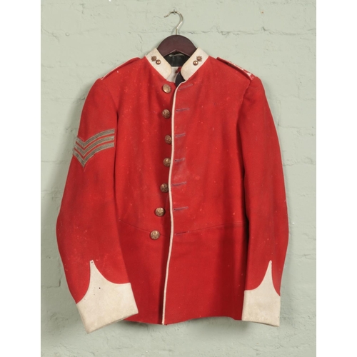 314 - An early 20th century military scarlet dress tunic. Bears War Department label for 1909.