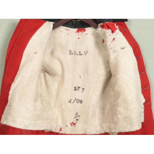 314 - An early 20th century military scarlet dress tunic. Bears War Department label for 1909.