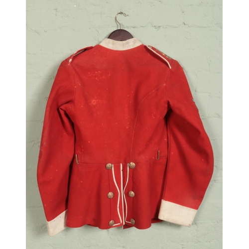 314 - An early 20th century military scarlet dress tunic. Bears War Department label for 1909.