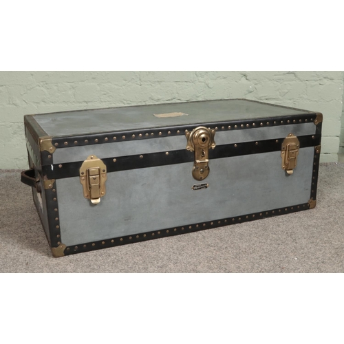 316 - A Mossman Made metal travel trunk, with studded edges. Height: 33cm, Width: 90cm, Depth: 52cm.