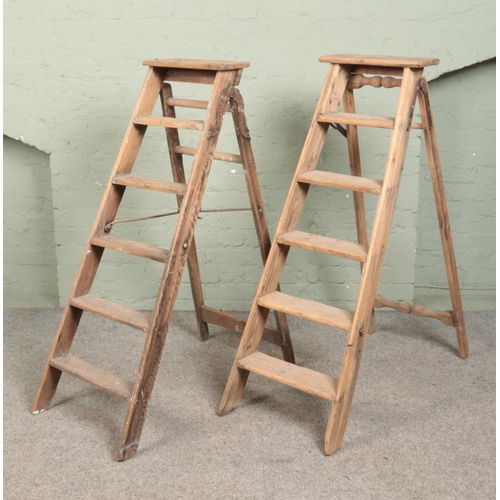 321 - Two pairs of vintage five-rung wooden stepladders. To include Simplex example.