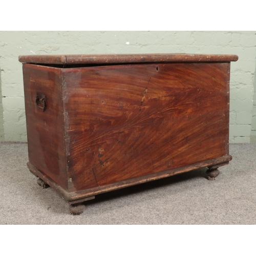 322 - A painted pine toolchest/blanket box, with candle compartment. Height: 68cm, Width: 94cm, Depth: 53c... 