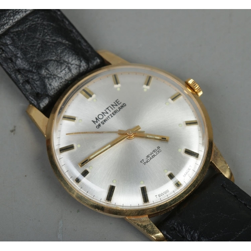 392 - A Gent's manual wind Montine of Switzerland wristwatch on black leather strap. With silvered dial an... 