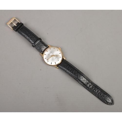 392 - A Gent's manual wind Montine of Switzerland wristwatch on black leather strap. With silvered dial an... 