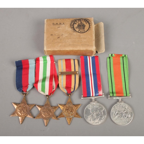 397 - A set of five WWII medals, with associated box, addressed to Mr. G Philipson. To include 1939-45 med... 