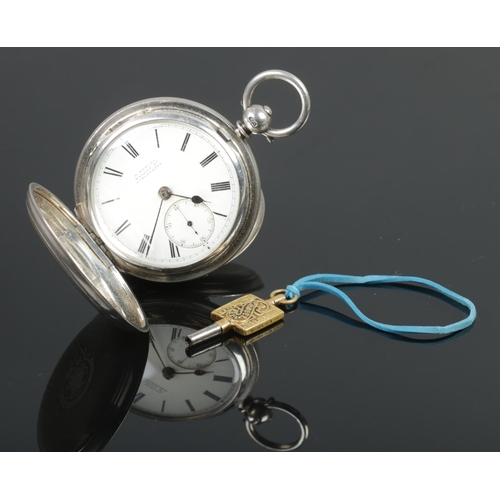 430 - A silver cased full hunter pocket watch, having engine turned case, enamel dial with subsidiary seco... 