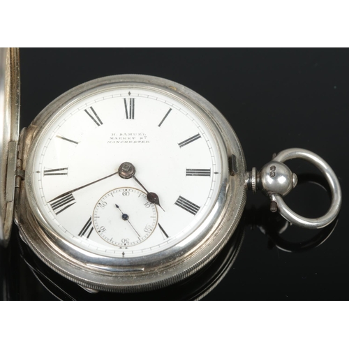 430 - A silver cased full hunter pocket watch, having engine turned case, enamel dial with subsidiary seco... 