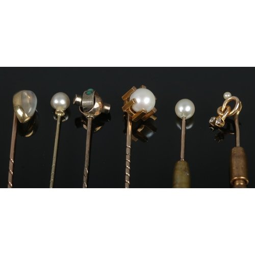 435 - Six gold stick pins, including examples set with diamonds, turquoise stones and pearls. Total weight... 