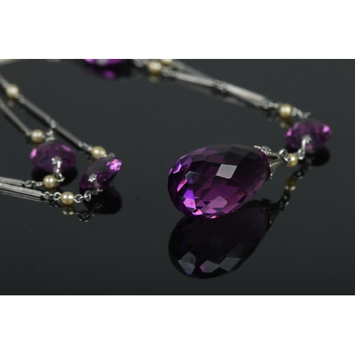 438 - An art deco Platinon necklace, set with small simulated pearls and amethyst coloured stones.