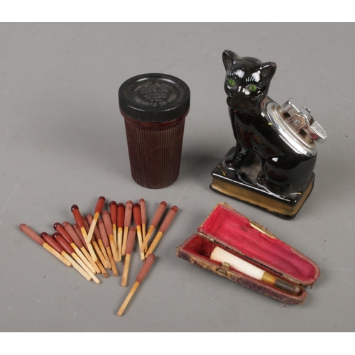 468 - A Bakelite case of Bryant & May Ships Lifeboat Matches along with a novelty ceramic cat lighter and ... 