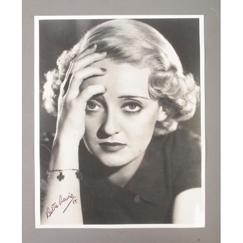 472 - A Bette Davis signed monochrome photograph dated for 1988.