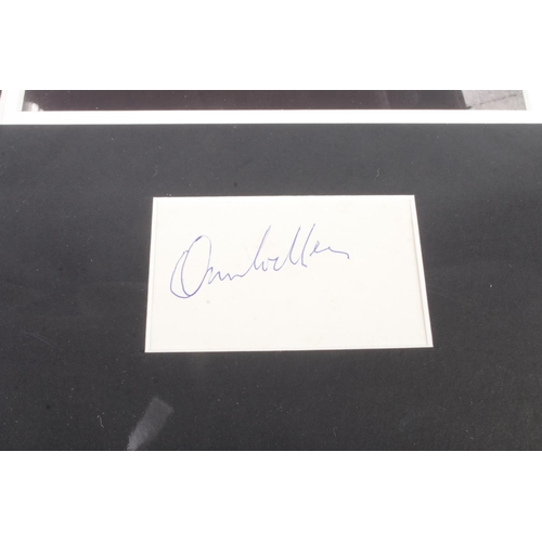 473 - An Orson Welles (1915-1985) autograph mounted alongside monochrome film still.