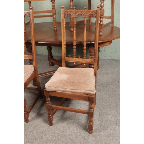 544 - An Ercol extending dining table with set of four Old Colonial Ercol design chairs.

Hx72cm 
Wx164cm ... 