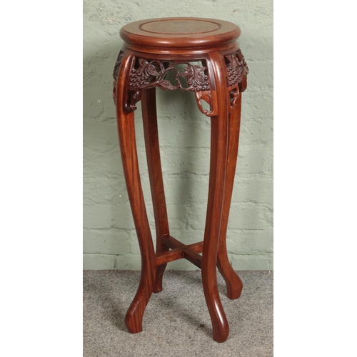 549 - A hardwood carved jardinière stand.

Hx82cm