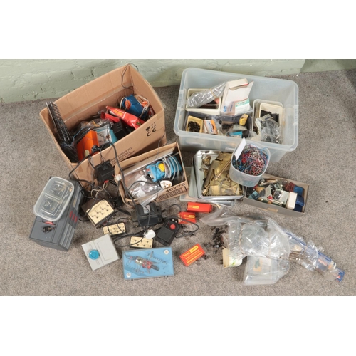 242 - Two boxes of assorted model railway spares and repairs to include wiring and controllers, railway wh... 