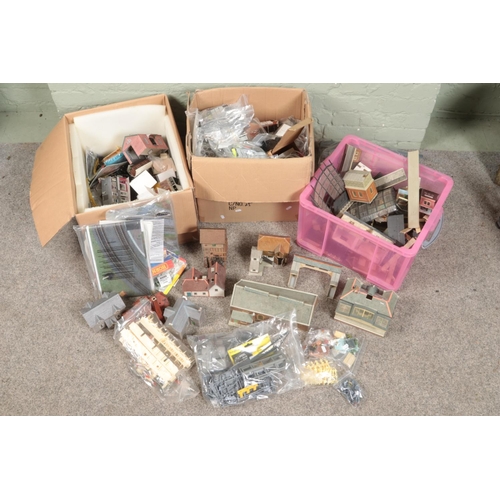 244 - Three large boxes of railway diorama accessories including a large quantity of buildings, miniatures... 