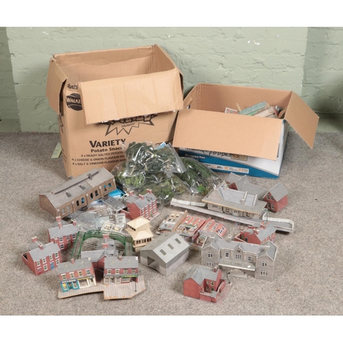 249 - Two large boxes of railway diorama accessories mostly of buildings including, platform buildings, sh... 