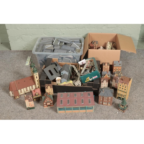 250 - Three large boxes of railway diorama accessories including a large quantity of buildings including c... 