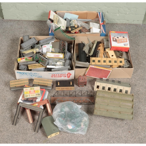 255 - Three boxes of railway diorama accessories including a large quantity of buildings, platform pieces,... 