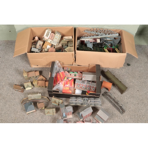 256 - Three large boxes of railway diorama accessories including a large quantity of buildings, miniatures... 