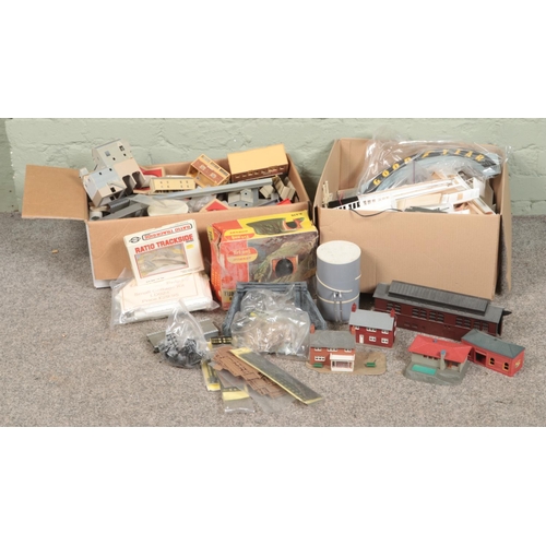 257 - Two boxes of railway diorama accessories including a large quantity of buildings, Tri-ang Hornby tun... 