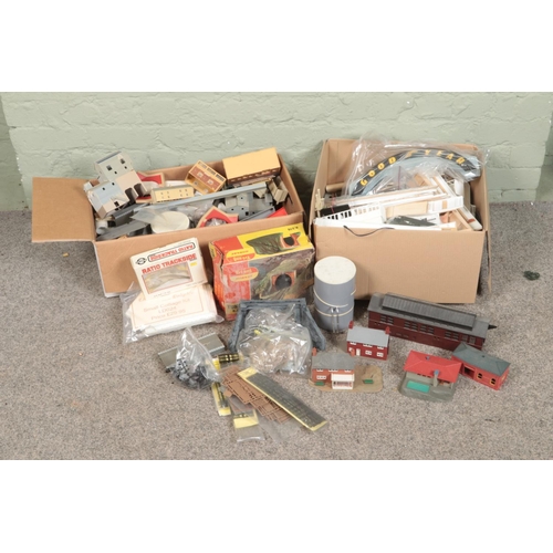 257 - Two boxes of railway diorama accessories including a large quantity of buildings, Tri-ang Hornby tun... 