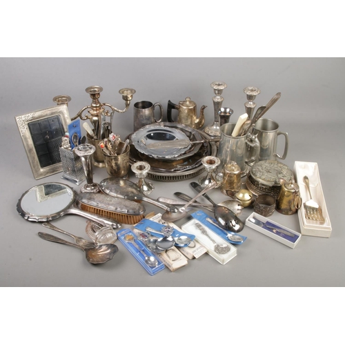 265 - A box of metalwares containing a large amount of EPNS silver plate including silver plate candlestic... 