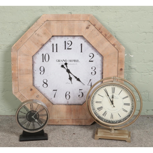 384 - A collection of modern clocks including an extra large wall clock with thick wooden frame.