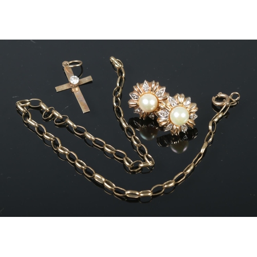 391 - A 9ct gold diamond cross pendant with with 9ct gold rolo link bracelet and a pair of yellow metal ea... 