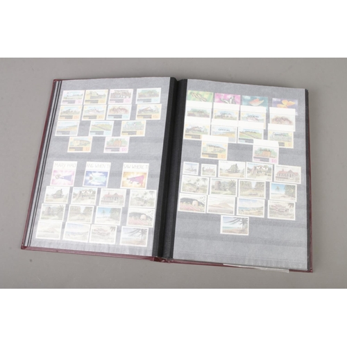 74 - An album of unmounted mint stamps from around the world many with full sets