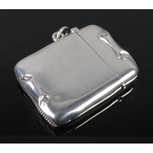 415 - A silver vesta case with scrolling design assayed Birmingham 1896 Henry Matthews, 28.8g